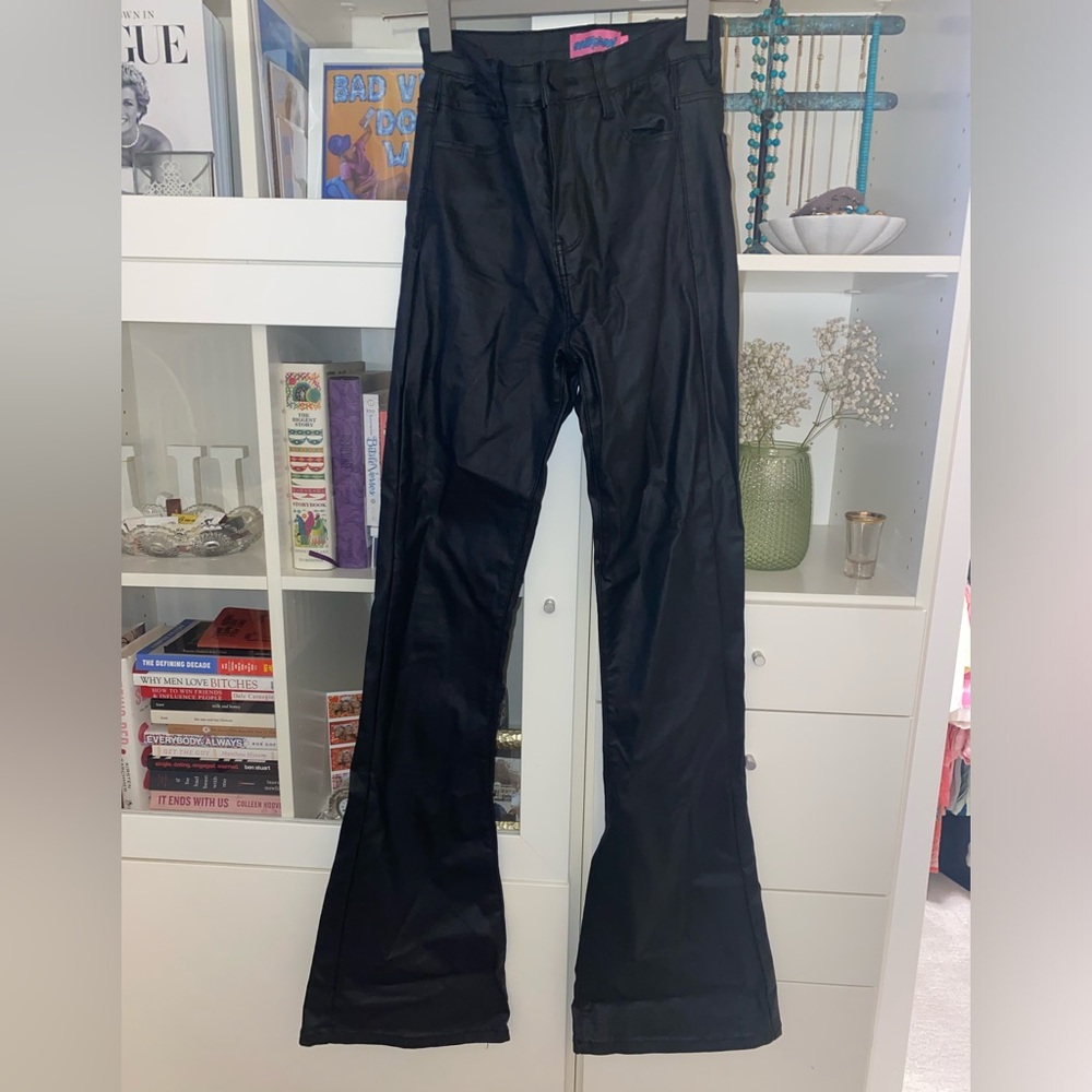 Edikted “Luna Feaux Leather Flare Jeans.”